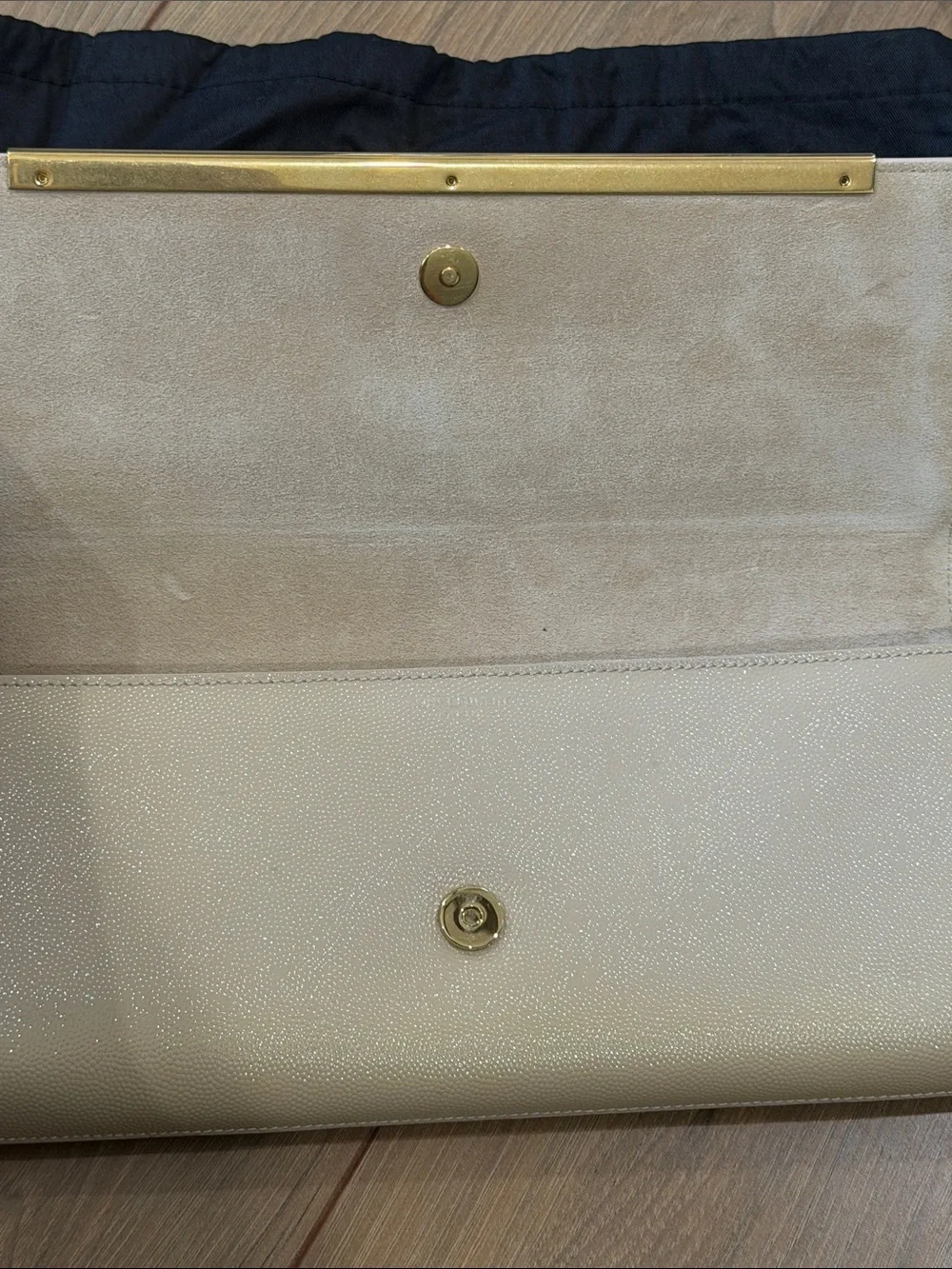 Saint Laurent Beige Leather Clutch with Gold Bar Accent